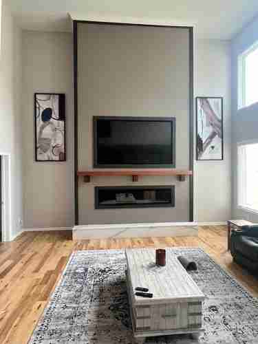 After design and build of a new fireplace with built in large screen tv